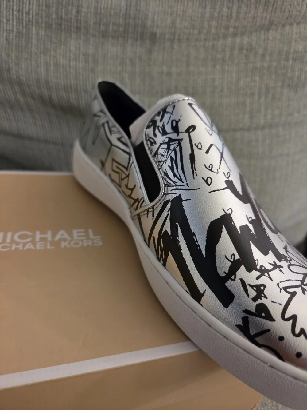 Michael Kors White Slip-On Sneakers with Black Graffiti